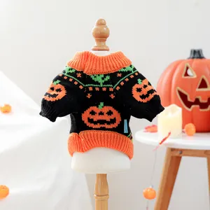 Detail of Halloween pet knit sweater featuring pumpkin patterns and ribbed orange cuffs