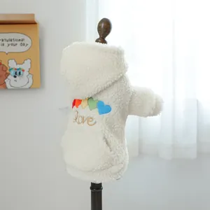 Detail of warm lamb wool pet hoodie featuring colorful heart patches and Love embroidery