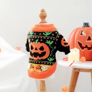 Detail of Halloween pet knit sweater with orange pumpkin and bat pattern on display