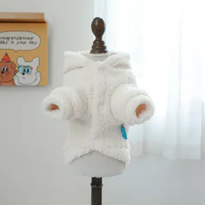 Close-up of off-white sherpa pet hoodie showing soft grainy texture and button closure