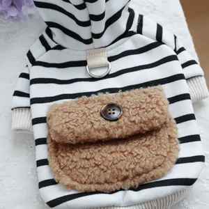 Close-up of pet hoodie featuring black stripes, cozy plush pocket, and a metal D-ring attachment