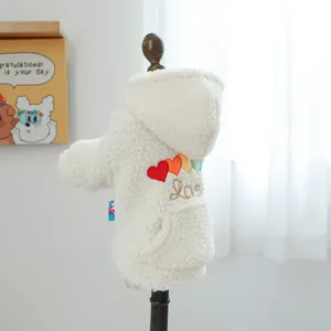 Detail view of rainbow heart embroidery and Love text on white sherpa pet hoodie jacket