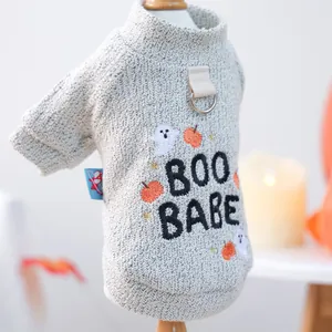 Detail of grey pet sweater with BOO BABE embroidery and D-ring for leash attachment