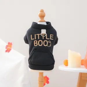 Detail of Little Boo embroidery and leash ring on a festive black pet hoodie