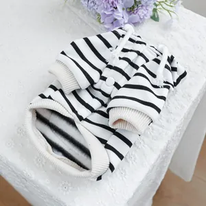 Detail of striped pet hoodie with cotton texture, white drawstring and snap buttons