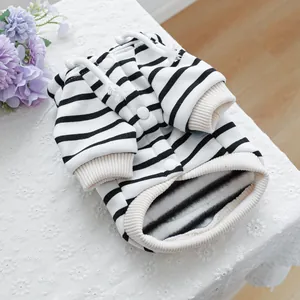 Detail of pet hoodie featuring black and white stripes with warm fleece lining and hood