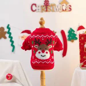 Detail of red Christmas pet sweater featuring knitted reindeer and snowflake patterns