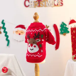 Close-up of a red Christmas pet sweater with elk pattern on a wooden display stand