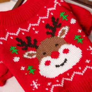 Macro detail of red Christmas pet sweater with reindeer embroidery and knit texture
