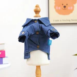 Detail view of denim pet jacket with vintage copper buttons and textured stitch craft
