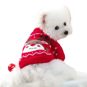 Red Christmas pet sweater with reindeer knit pattern on a white dog for winter season