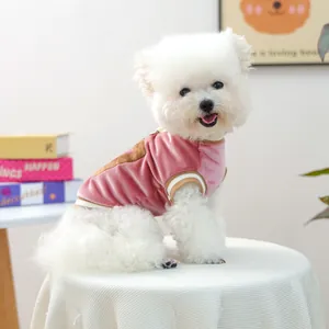 Close-up of pink velvet pet vest with soft texture and striped ribbing for small dogs