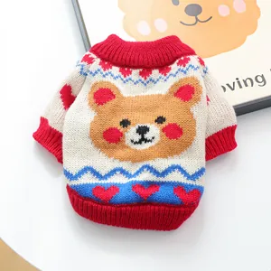 Close-up of knit texture with cartoon bear and heart patterns on the pet sweater