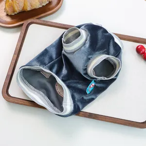 Close-up of velvet pet vest texture with ribbed edges on a cozy decorative tray