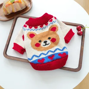 Detailed close-up of soft knit pet sweater with cartoon bear and heart patterns