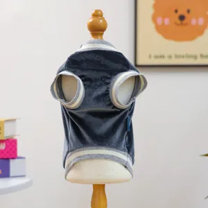 Close-up of velvet pet vest with striped ribbed cuffs on a wooden mannequin stand