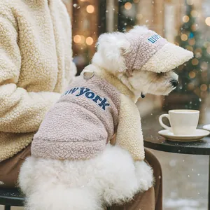 Detail of pink sherpa dog vest with New York embroidery and matching baseball cap