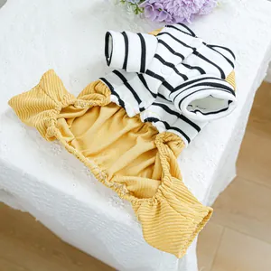 Detail of striped pet jumpsuit with yellow corduroy pants and button closure