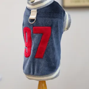 Close-up of velvet pet vest with embroidered number 97 and a metal D-ring for leash