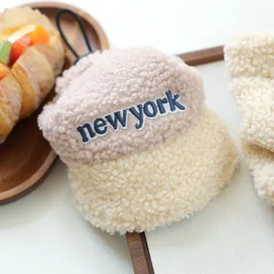 Detail of plush New York baseball cap with sherpa texture and embroidery for pets