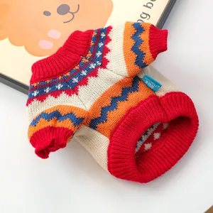 Detail of colorful Fair Isle knit pattern and red ribbed collar on pet winter sweater