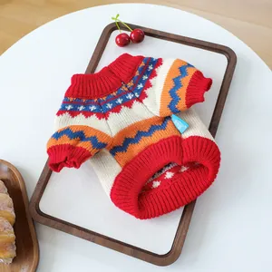 Detailed close-up of Fair Isle knit pet sweater with ribbed cuffs and retro geometric patterns