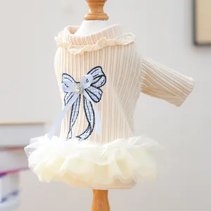 Detail of pet knit dress with lace collar, blue plaid bow and rhinestone accents