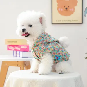 Colorful knitted pet hoodie for small dogs with white pom-pom details and warm hood
