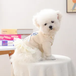 Knitted pet dress for small dogs featuring blue bow embroidery and white mesh tutu skirt
