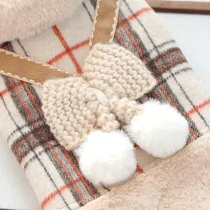 Plaid pet vest for small dogs and cats with plush trim and white pom-pom bow details