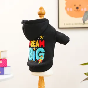 Detail of black pet hoodie with colorful Dream Big embroidery and rocket design