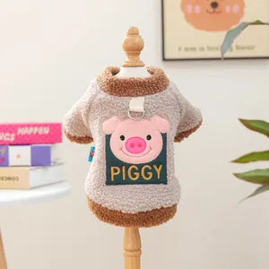 Detail of warm lamb wool pet sweater with piggy embroidery and functional metal D-ring