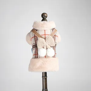 Warm plaid pet vest for dogs and cats featuring cream faux fur trim and a knit bow accent