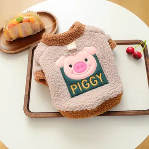 Close-up of warm teddy velvet dog vest with piggy embroidery and metal D-ring attachment