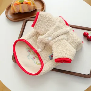 Detail of plush fleece pet vest with red trim and cute festive embroidery for small dogs