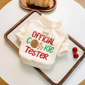 Detail of pet sweater showing textured rib knit fabric and official cookie tester embroidery