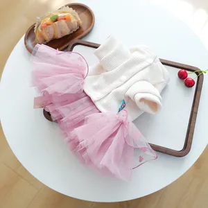 Detail view of pet dress with white knit top and pink heart-patterned mesh tutu skirt