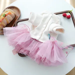 Detail of pet princess wedding dress with knit cardigan and pink tulle glitter heart skirt