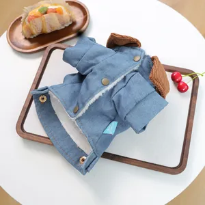 Close-up of denim pet coat with corduroy collar, copper snaps and warm fleece lining