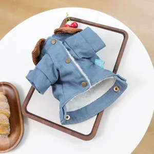 Detail view of denim pet coat with corduroy collar and warm faux lamb wool lining