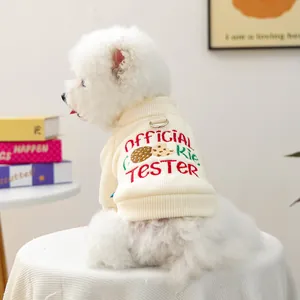 Detail of cream ribbed knit pet sweater with 'OFFICIAL Cookie TESTER' embroidery and D-ring