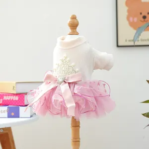 Detail of pet princess dress featuring pink mesh tutu and satin bow with heart rhinestone