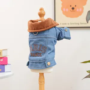 Detail of blue denim pet jacket with corduroy collar and Paris embroidery on back