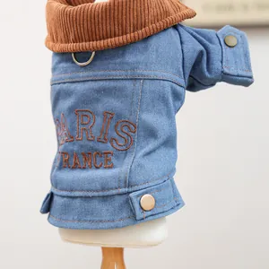 Close-up of dog denim jacket with Paris embroidery and brown corduroy collar detail
