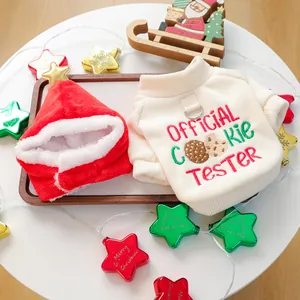 Close-up of festive Christmas pet sweater set with official cookie tester embroidery