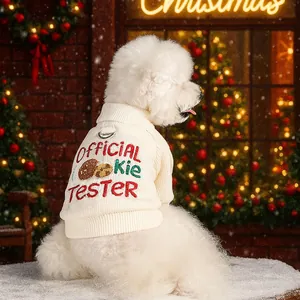 Off-white Christmas pet sweater with D-ring and cookie tester embroidery in festive setting