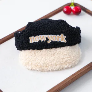 Detail of pet baseball cap in teddy fleece with New York embroidery for dogs and cats
