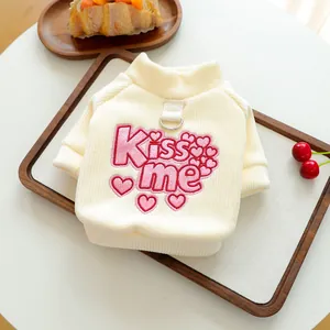 Detail of pet sweatshirt with metal D-ring attachment and pink Kiss Me sequin embroidery