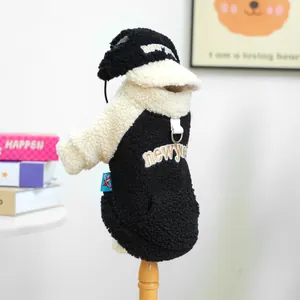 Detail of fleece pet hoodie with New York embroidery and matching baseball cap