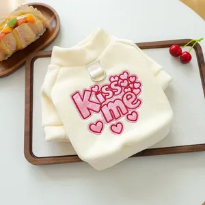 Beige knit dog sweater with pink sequined Kiss Me heart embroidery and metal D-ring